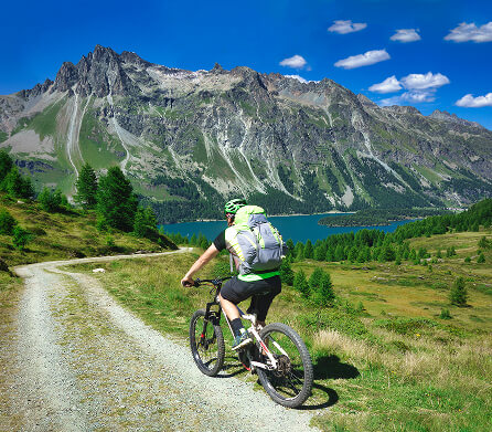 Mountain biker riding through the Alps
