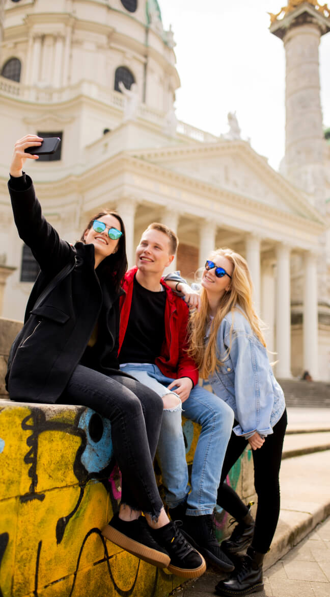Travelers taking a selfie during a city tour