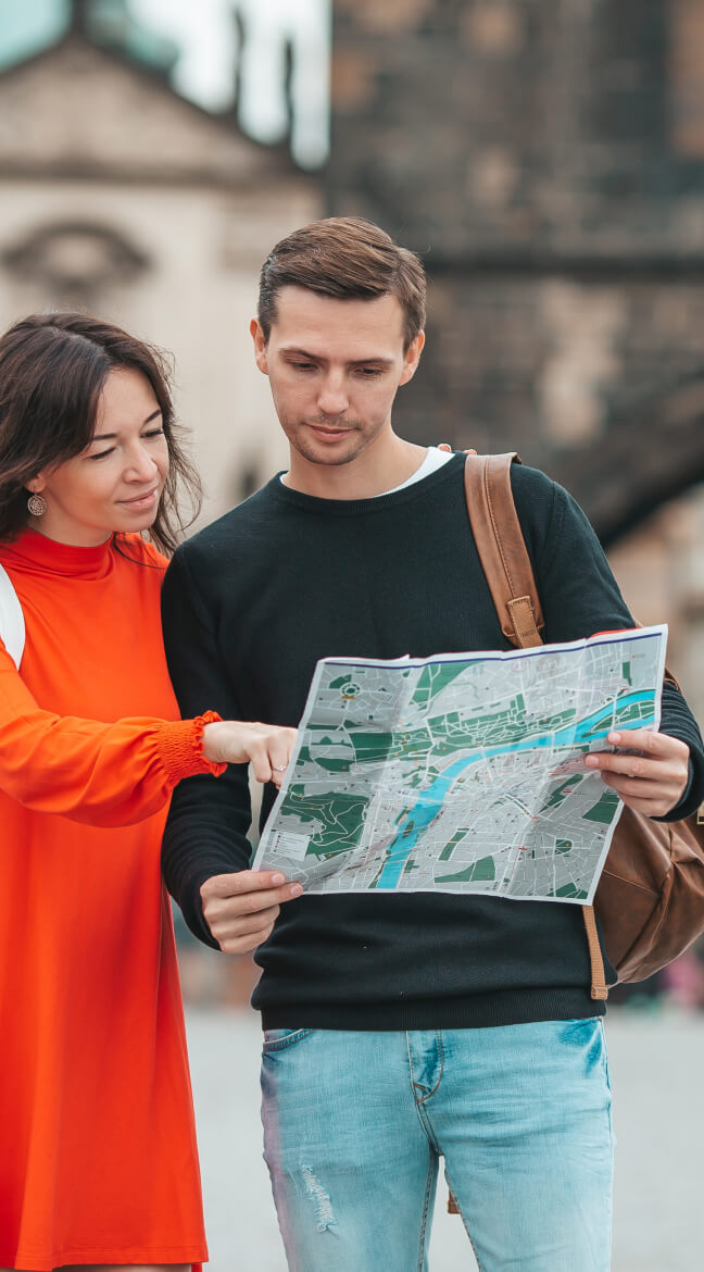 Travelers using a city map
